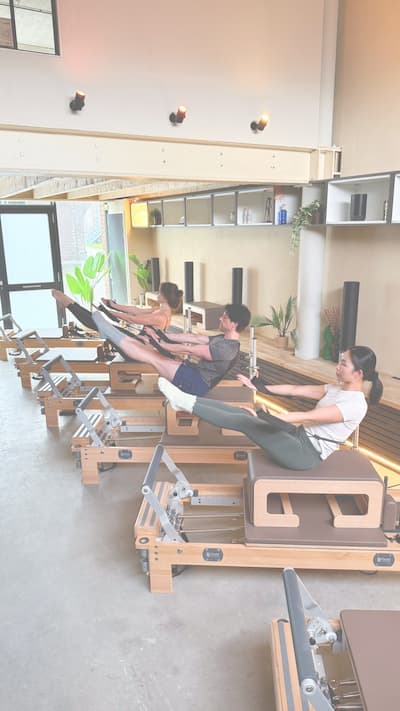Participants on the reformer during a class
